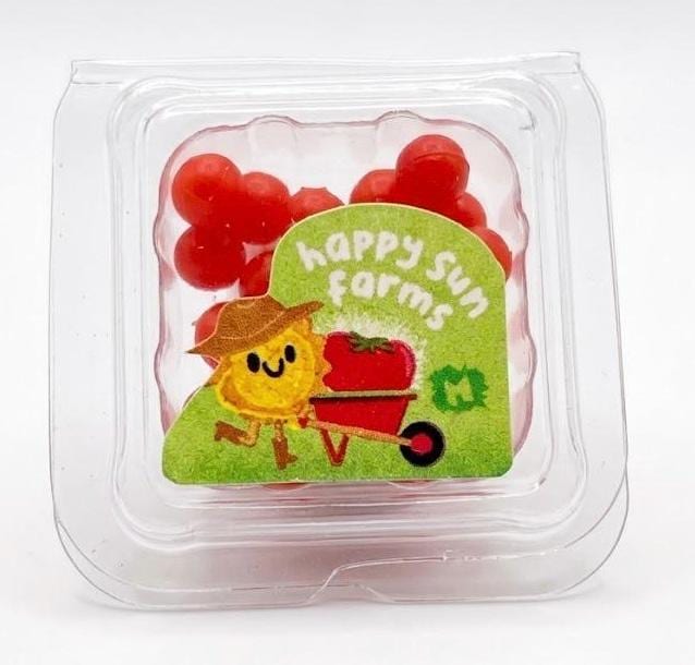Packaged red gummy candies with a 'Happy Sours Farms' label on a white background