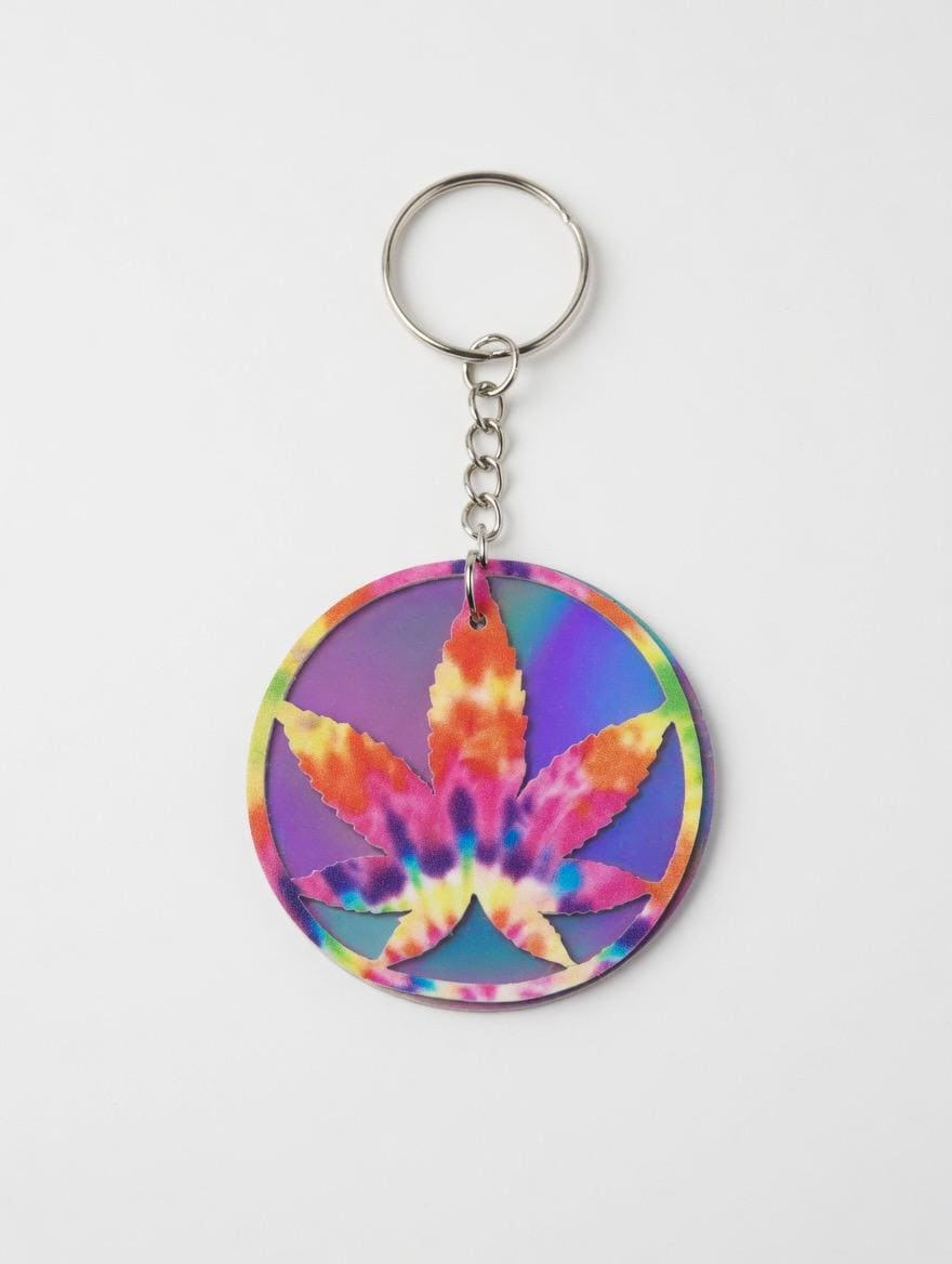 Tie-dye marijuana leaf keychain on a white background